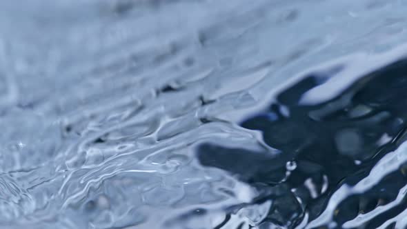 Super Slow Motion Abstract Shot of Waving Water Surface at 1000Fps alt