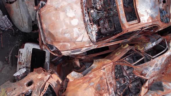 Vertical Video of Burnt Cars During the War in Ukraine alt