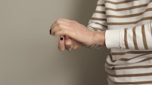 Coronavirus. Prevention. Woman Wipes her Hands with Alcoholic Hand Sanitizer.