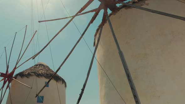 POV Shot Featuring Traditional Windmills in Mykonos alt