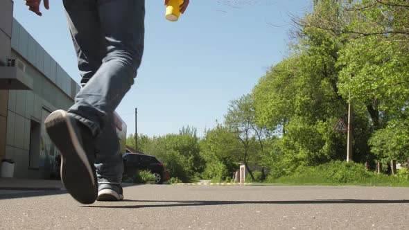 A Man Throws Out Paper Cup on the Ground alt