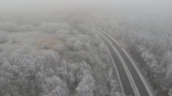 Foggy Landscape With Long Country Road Winter Weather Pull Back Aerial alt