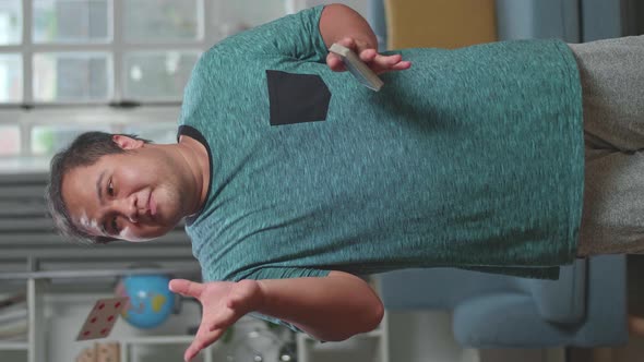 Asian Man Blogger Shoots Video Content For Social Networks, Magician With Playing Cards alt