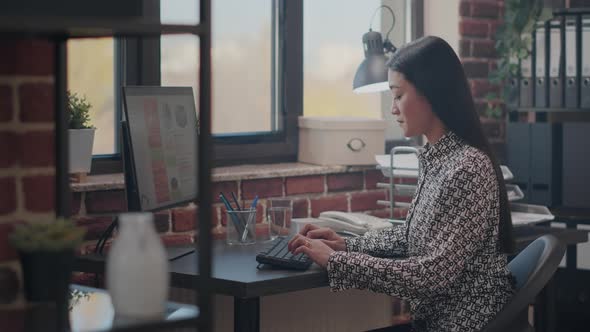 Employee Working on Business Project with Computer alt