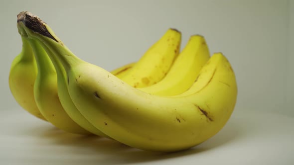 Four Banana In A Turntable Looks Fresh And Delicious - Close Up Shot alt
