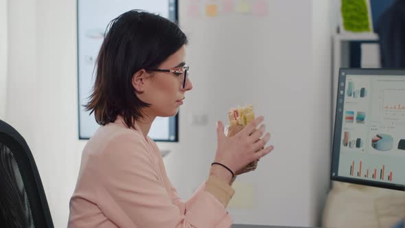 Entrepreneur Woman Eating Tasty Sandwich Having Meal Break Working in Business Company alt