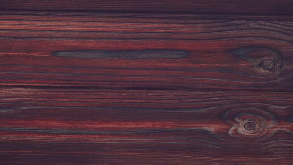Flat lay. Large wedges of gourmet cheese on a rustic wood background. alt