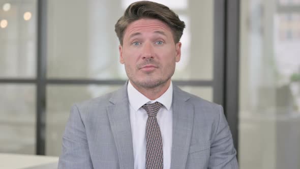 Middle Aged Man Talking on Online Video Call alt