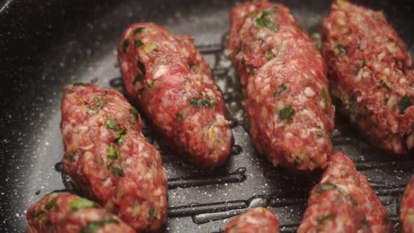 Salisbury steaks frying on pan alt