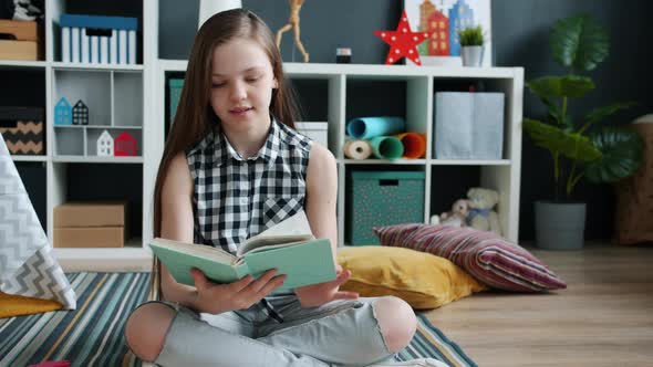 Cheerful Kid Reading Book Enjoying Activity Having Fun Alone in Apartment alt