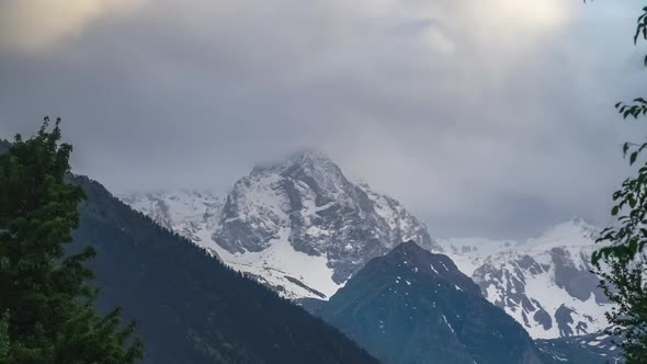 Caucasian Mountain Peak Covered with Snow on Cloudy Day