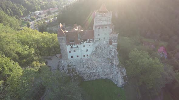 Aerial view of Bran Castle and a road nearby