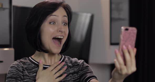 Woman Having Video Chat Using Smartphone Enjoying Chatting To Friend alt