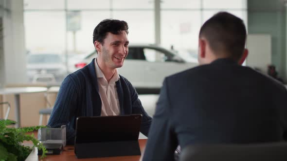 Car Business Portrait of Satisfied Male Customer Talking to Sales Manager in Vehicle in Automobile