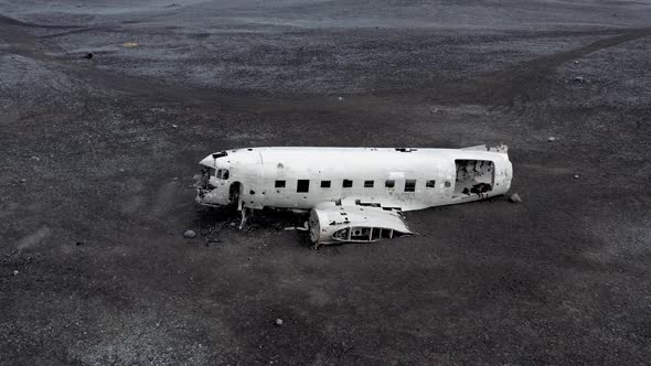 Aerial of an Abandoned Crashed Plane Wreckage on Solheimasandur Beach Iceland alt