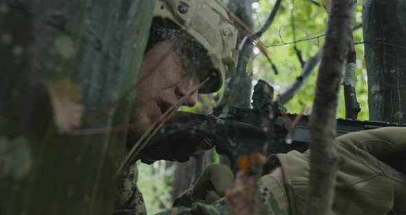 Fully Equipped Rifle Soldier Wearing Camouflage Uniform Attacking Enemy Rifle in Firing Position in alt