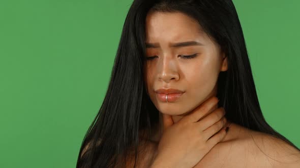 Beautiful Asian Woman Feeling Sick and Coughing on Green Chromakey alt