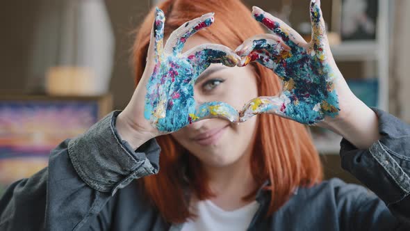 Portrait Redhaired Girl Talented Artist Female Painter Stands Posing in Workshop Shows Gesture of alt