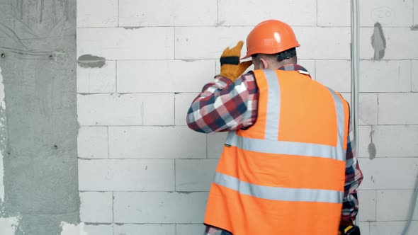 Young Worker Dancing on Construction Site