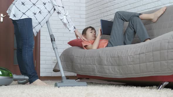 Teen girl playing with a gadget. alt