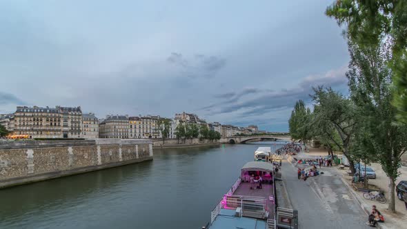View to the Pont De La Tournelle on the River Seine Day to Night Timelapse with Waterfront alt