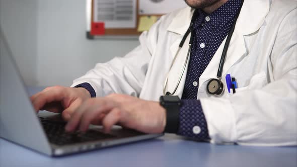 Close Up Shot of Medical Worker Working Using Laptop. alt