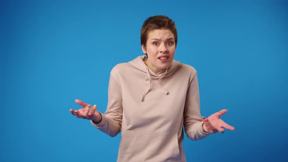 Puzzled Young Woman Showing She Doesn't Understand