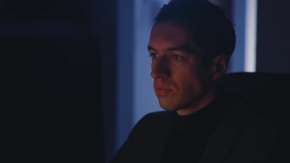 Young Businessman Man Working at Laptop Computer Late at Night alt