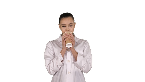 Young latin doctor having a break and drinking coffee on alt