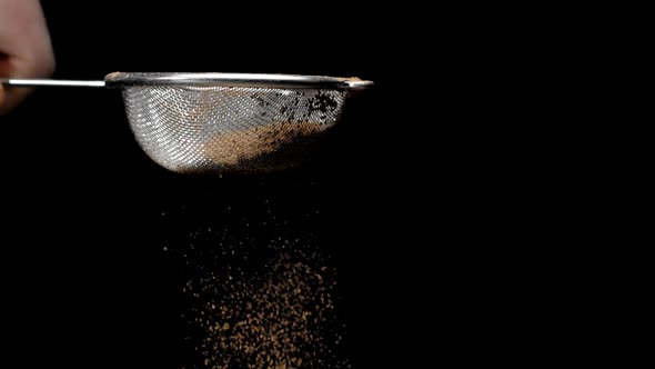 Brown Cinnamon Cocoa Powder Sifting with Strainer in Slow Motion, Baking