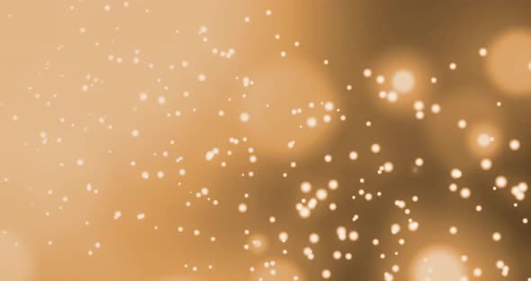 Animation of multiple glowing gold spots of light moving in hypnotic motion on black background alt