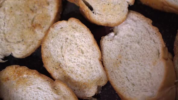Breadcrumbs From the Loaf are Fried in a Hot Frying Pan