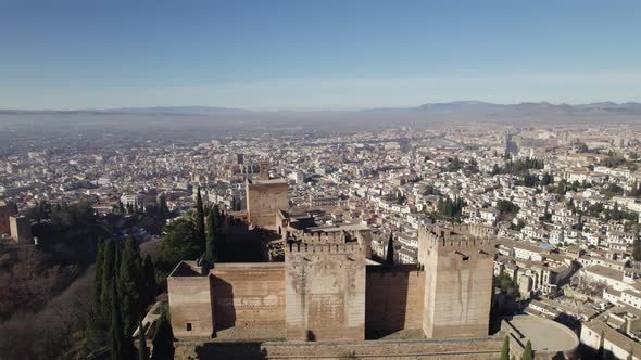Alhambra and cityscape in background, Granada in Spain. Aerial drone panoramic view. Sky for copy sp