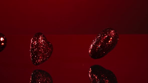 Decorations falling, bouncing in ultra slow mo 1500fps - reflective surface - VALENTINES PHANTOM 008 alt