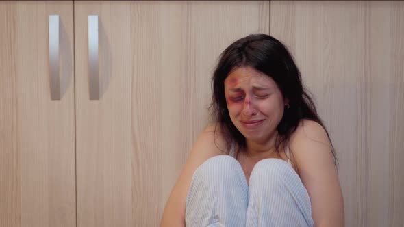 Drunk Man Standing Over a Crying Woman alt