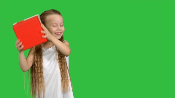 Happy Smiling Girl Holding Gift Box on A Green Screen, Chroma Key