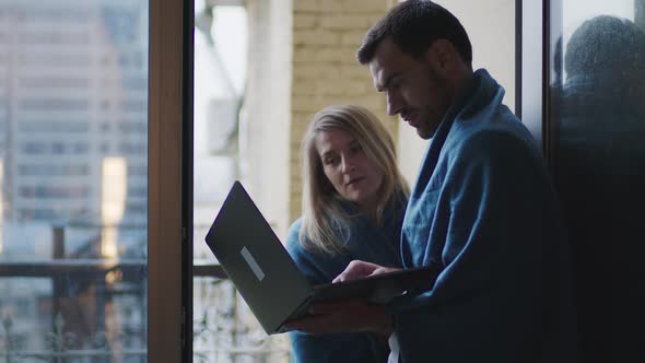 A Young Couple is Working Remotely From Home Having Fun with Each Other alt