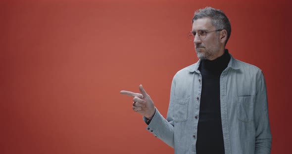 Middle-aged Man Pointing Right alt