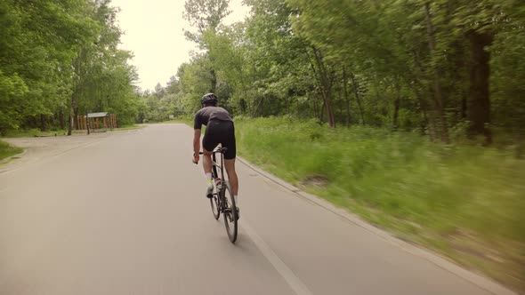 Hard Workout.Triathlete Cyclist Training Bicycle. Cyclist Sport Recreation Fitness Riding Triathlon. alt