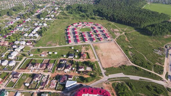 Aerial View of New Modern Cottages Townhouses in a Suburban Settlement alt