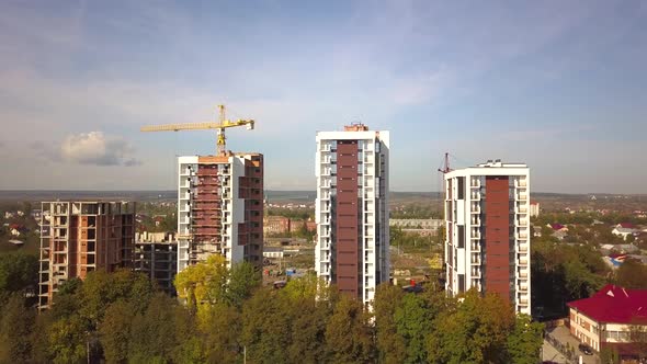 Aerial view of high residential apartment buildings under construction. Real estate development. alt