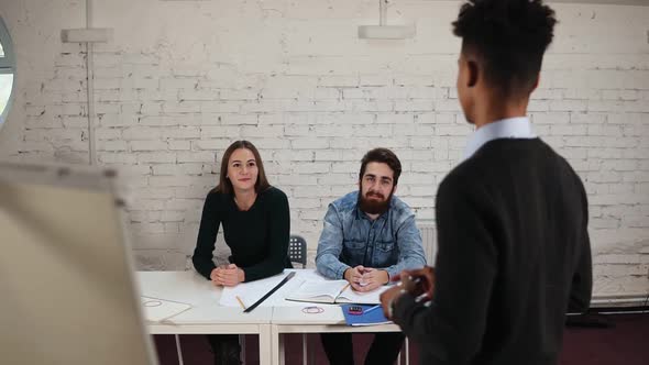 African American Office Worker Finishing Corporate Presentation for Businesspeople in Office Dark alt