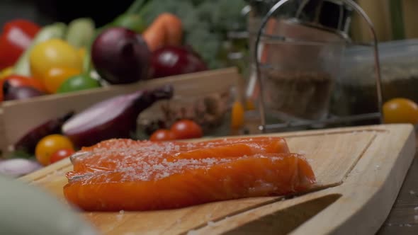 Two Slices of Salmon on the Cutting Board alt