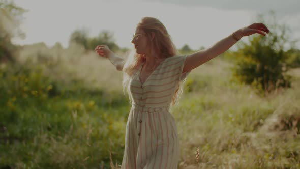 Happy Young Carefree Hippie Dancing in the Sun alt