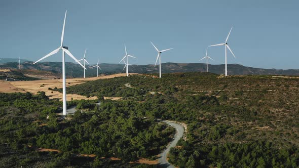 Modern Wind Turbines Windmills Rotate Generate Alternative Green Energy Electricity on Plant