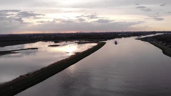 Reflection Of Sunlight On The Calm Waters Of Noord River In The Netherlands. aerial alt