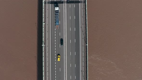 Top down drone shot of busy motorway highway bridge alt