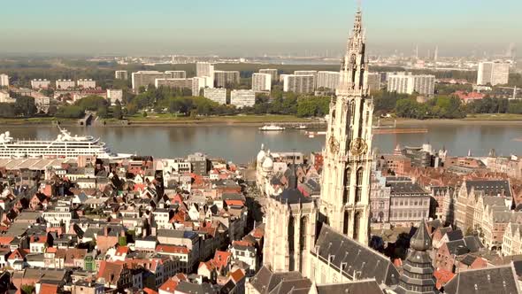 Cathedral of Our Lady , Antwerp, Belgium. Cityscape view and Scheldt River.  Orbiting shot alt