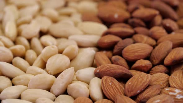 Almond nuts rotating close up.  Abstract background of organic ecological almond nuts.