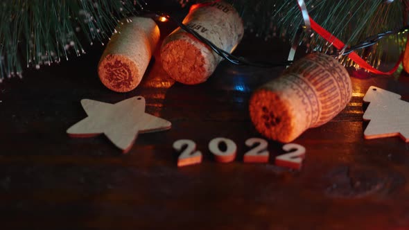 Happy New Year 2022. The camera moves from the top of the Christmas tree with cones, garlands alt
